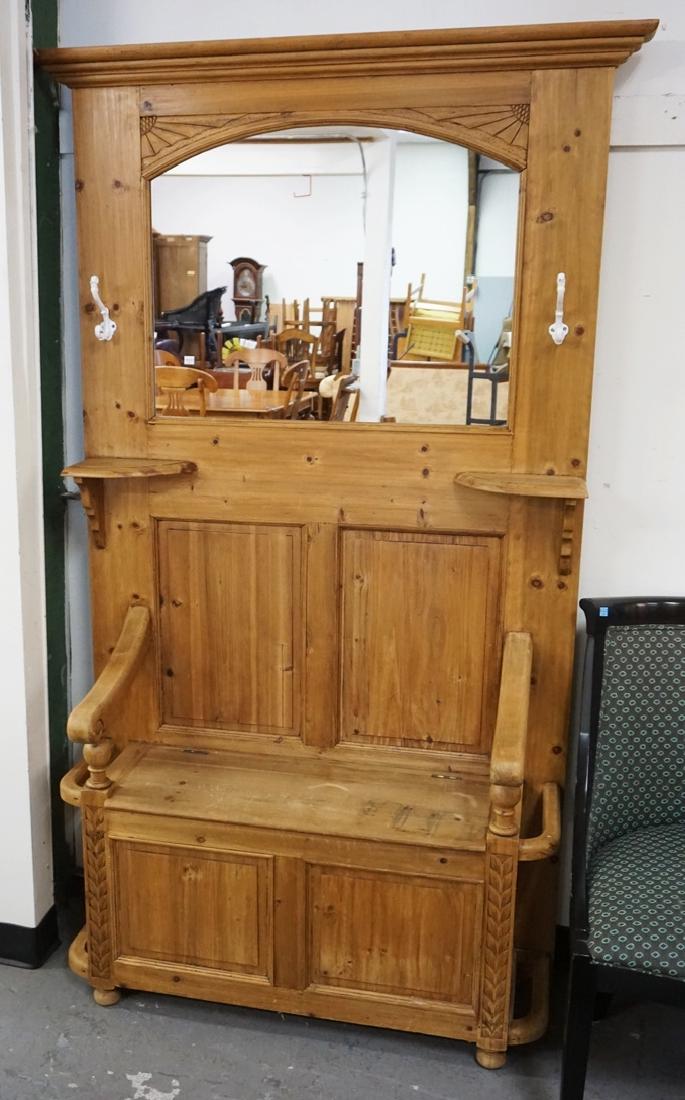 PINE HALL RACK: PINE HALL RACK. LIFT SEAT. MIRRORED BACK. PANELED. 78 INCHES HIGH. 47 INCHES WIDE.