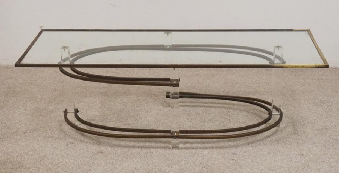 MID CENTURY MODERN LUCITE & BRASS TABLE: MID CENTURY MODERN LUCITE AND BRASS COFFEE TABLE WITH A FRAMED GLASS TOP. POSSIBLY VLADIMIR KAGAN. 19 X 53 1/2 INCH TOP.