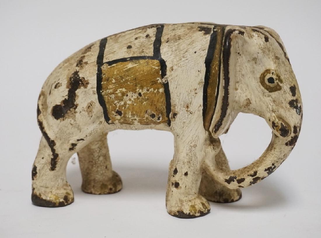 DOORSTOP: ANTIQUE FIGURAL CAST IRON ELEPHANT DOORSTOP. 5 INCHES HIGH.