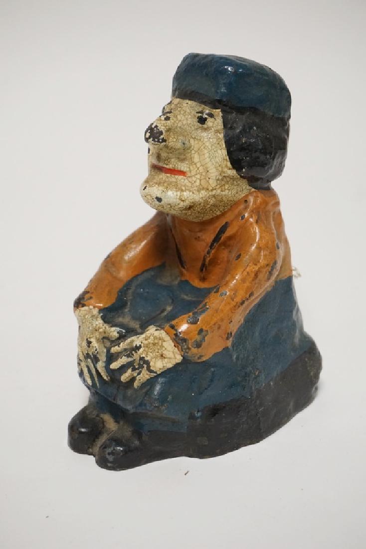 CHARACTER DOORSTOP: ANTIQUE CAST IRON CHARACTER DOORSTOP. 5 3/4 INCHES HIGH.