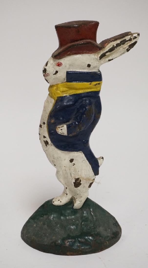 RABBIT DOORSTOP: CAST IRON FIGURAL RABBIT DOORSTOP. 10 INCHES HIGH.
