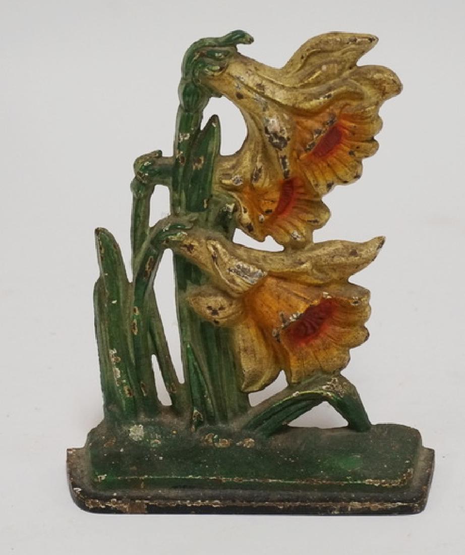 HUBLEY DOORSTOP: ANTIQUE HUBLEY CAST IRON *JONQUILS* DOORSTOP. 6 7/8 INCHES HIGH.