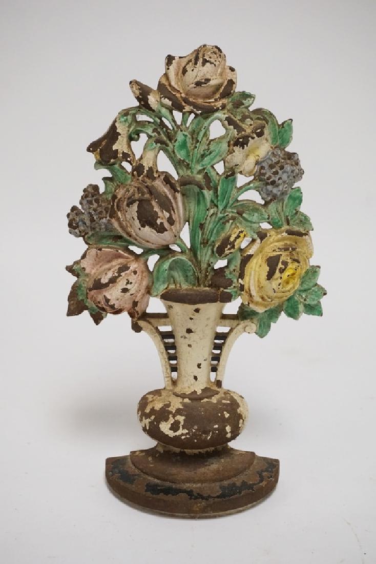 HUBLEY DOORSTOP: ANTIQUE HUBLEY CAST IRON TULIPS AND ROSES DOORSTOP. 10 1/2 INCHES HIGH.