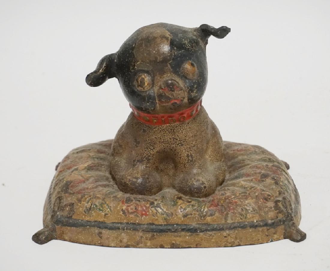 HUBLEY FIDO DOORSTOP: HUBLEY CAST IRON DOG ON A PILLOW FIDO DOORSTOP. 5 1/2 INCHES HIGH.