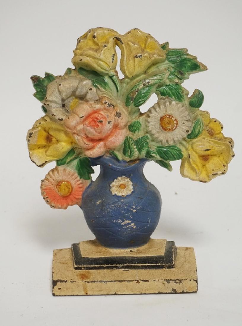 HUBLEY DOORSTOP: HUBLEY CAST IRON POLLIES & DAISYS DOORSTOP. #491. 7 1/4 INCHES HIGH.
