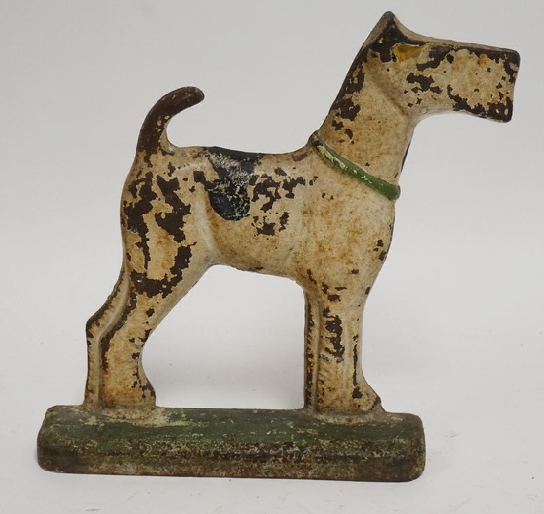 SCOTTIE DOG DOORSTOP: ANTIQUE CAST IRON SCOTTIE DOG DOORSTOP. 10 1/2 INCHES HIGH.