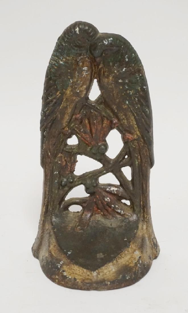 LOVEBIRDS DOORSTOP: CAST IRON LOVEBIRDS DOORSTOP. 7 INCHES HIGH.