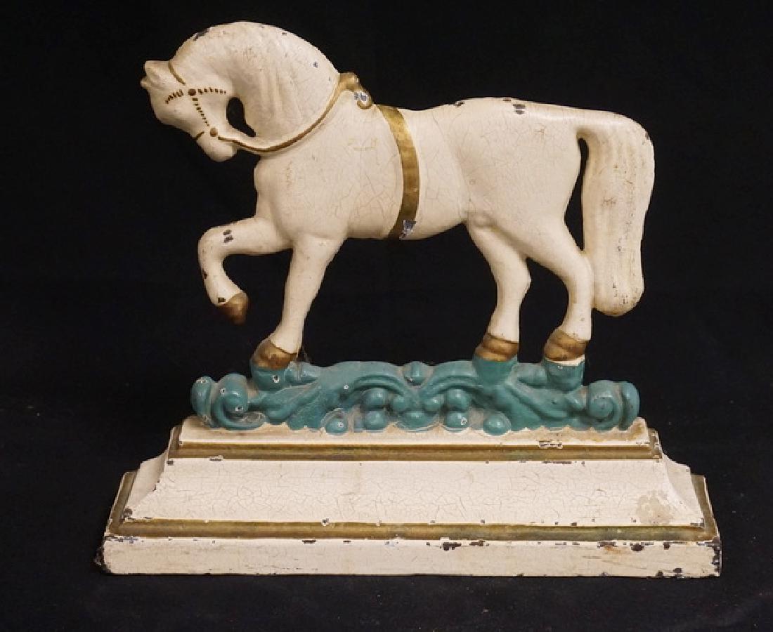 HORSE DOORSTOP: ANTIQUE CAST IRON HORSE DOORSTOP. 10 1/4 INCHES HIGH.