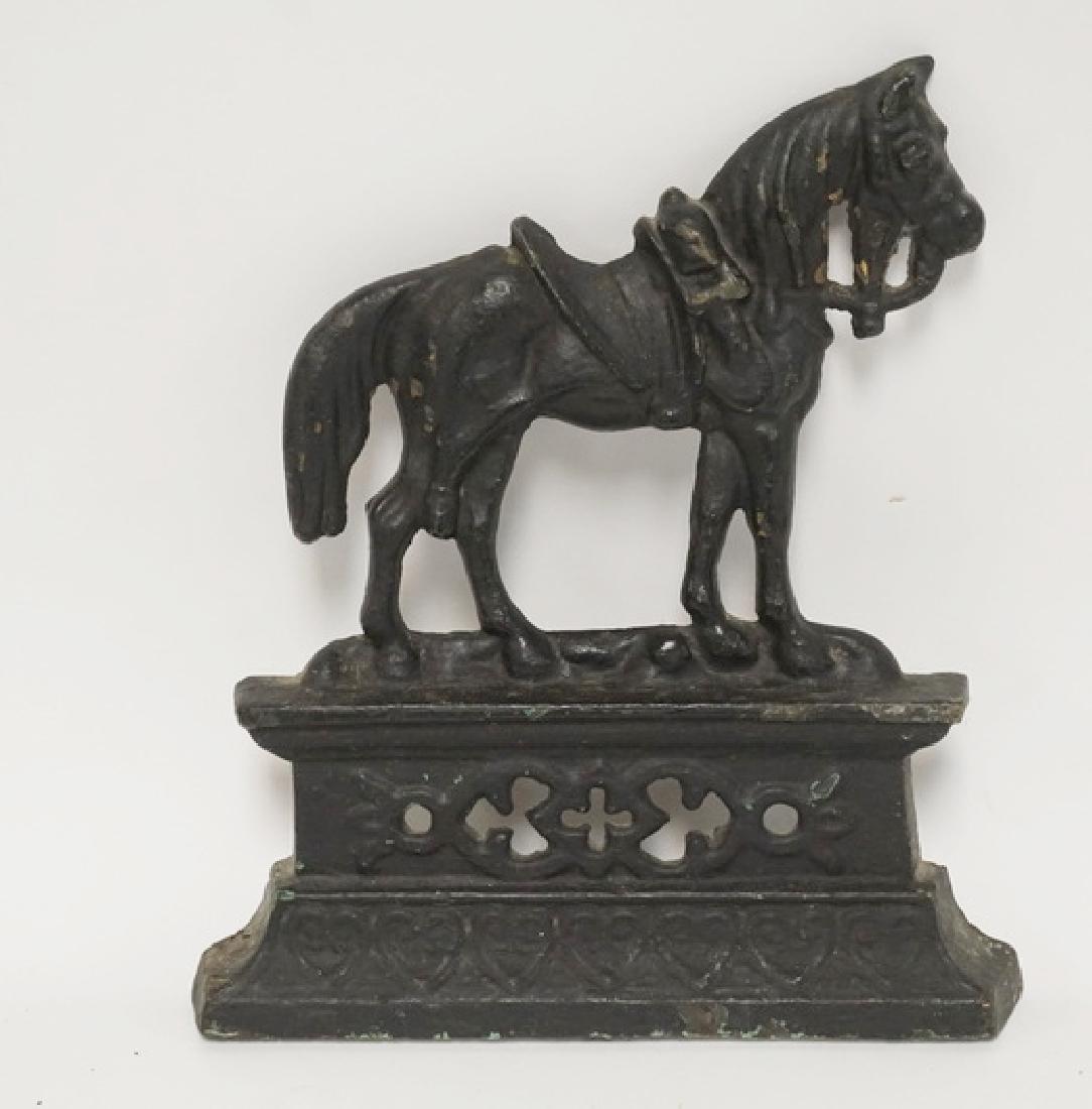 HORSE DOORSTOP: CAST IRON HORSE DOORSTOP. 9 7/8 INCHES HIGH.