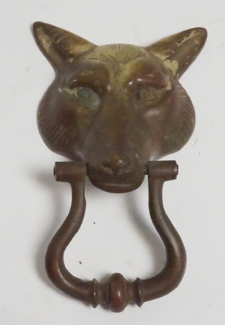 BRASS FOX HEAD DOOR KNOCKER: BRASS FOX HEAD DOOR KNOCKER. 5 1/8 INCHES WIDE. 8 1/4 INCHES LONG.