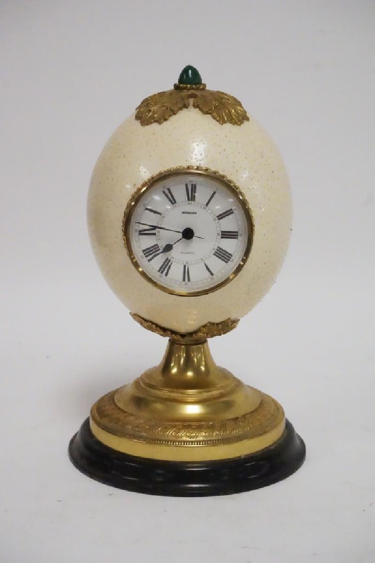 ORNAMENTAL CLOCK IN THE FORM OF AN OSTRICH EGG.: ORNAMENTAL CLOCK IN THE FORM OF AN OSTRICH EGG. QUARTZ MOVEMENT. 9 1/2 INCHES HIGH