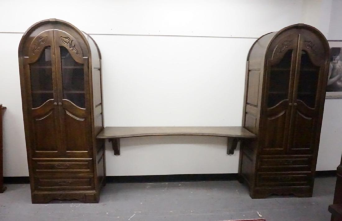 WALL UNIT: TWO ARCH TOP CABINETS JOINED BY A LONG SHELF.WIRE MESH DOORS. IDEAL FOR A FLAT SCREEN TV.SHELF IS 72 1/4 IN WIDE, OVERALL WIDTH 132 1/2 IN, 80 1/2 IN H