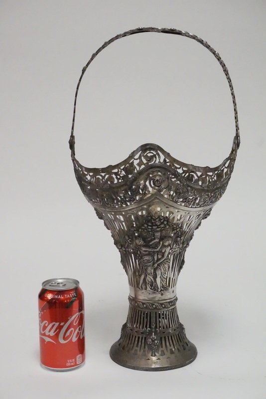 GERMAN .800 SILVER BASKET: GERMAN .800 SILVER BASKET WITH ORNATE OPENWORK AND REPOUSSE DECORATIONS. 18 3/4 INCHES HIGH. 37.50 TROY OZ.