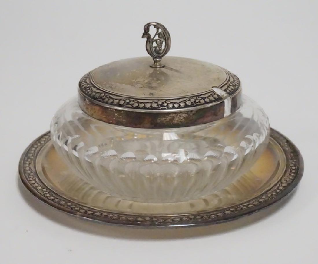 .800 SILVER & CUT GLASS: .800 SILVER & CUT GLASS CONDIMENT JAR WITH LID. LILY OF THE VALLEY BORDER. 6 1/2 INCH DIA. 3 3/4 INCHES HIGH.