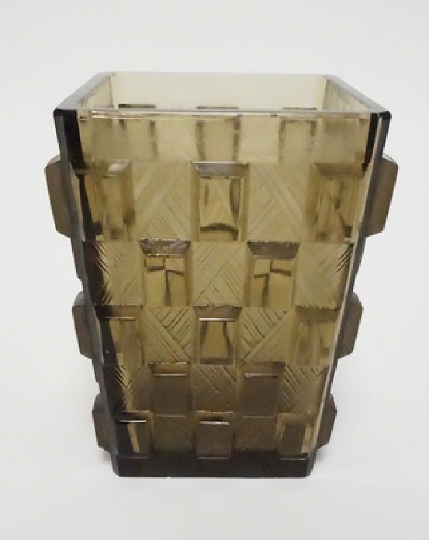 SABINO ART DECO VASE: SIGNED SABINO, FRANCE SMOKE GLASS VASE WITH CUT DESIGN. 6 IN H. HAS A BASE CHIP.