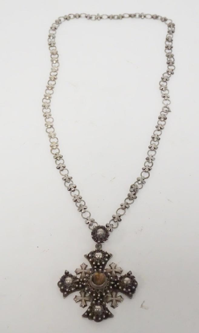 STERLING SILVER NECKLACE: STERLING SILVER NECKLACEWITH AN IRON CROSS FORM PENDANT WITH A TIGER EYE CABOCHON STONE. CHAIN IS 22 IN