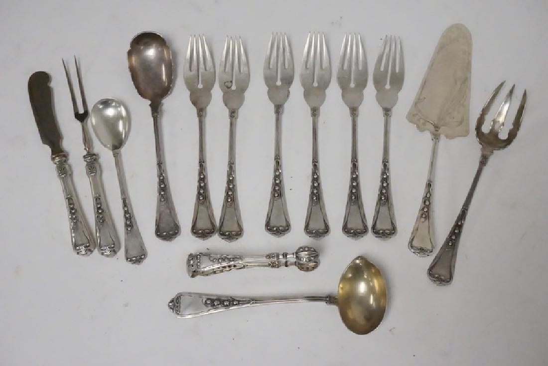 LILY OF THE VALLEY SILVER FLATWARE: 14 PIECES OF .800 SILVER FLATWARE IN THE LILY OF THE VALLEY PATTERN. 14.70 TROY OZ (NOT INCLUDING 2 SMALL HANDLES)