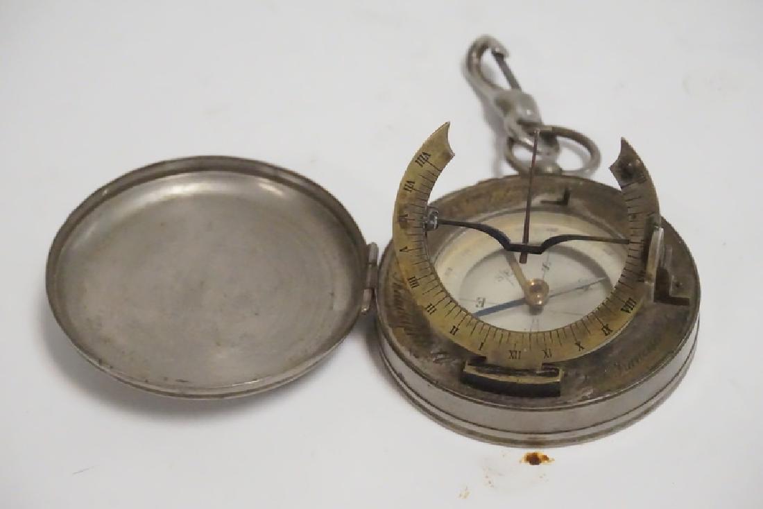 MARITIME COMPASS WITH SUNDIAL: MARITIME COMPASS WITH SUNDIAL. HAS THE NAMES OF CITIES ENGRAVED AROUND THE RIM, 2 3/4 INCH DIA.