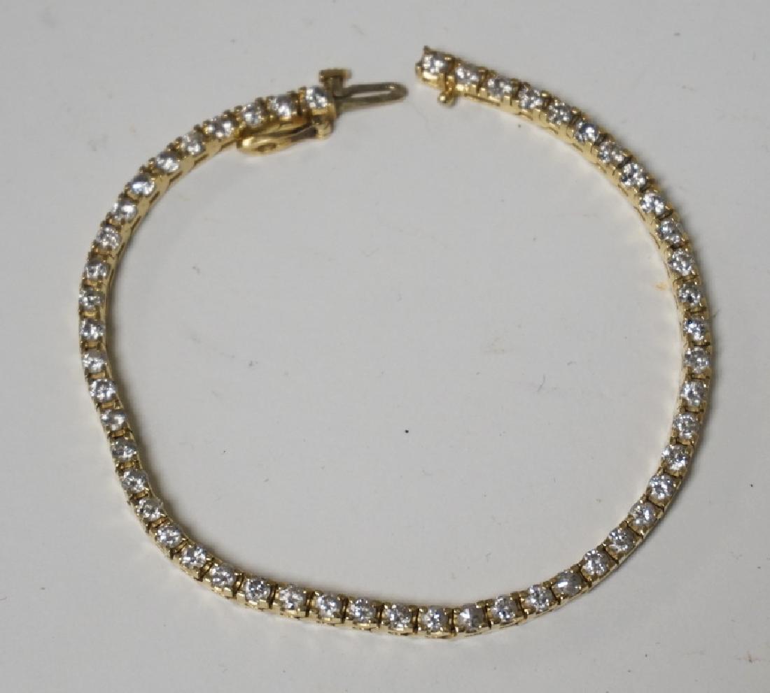 GOLD & DIAMOND TENNIS BRACELET: 14K GOLD & DIAMOND TENNIS BRACELET. 52 FULL CUT DIAMONDS. 7 INCHES LONG. 7.15 DWT. 4.25 CTW.