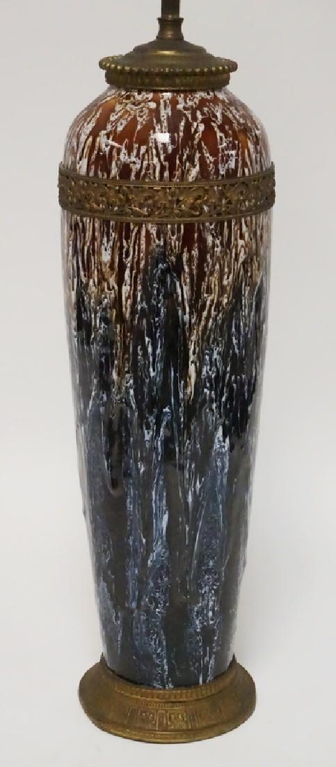 BOCH FRERES LAMP: BOCH FRERES POTTERY LAMP WITH A STUNNING DRIP GLAZE SHADED FROM CHOCOLATE TO COBALT BLUE. ORNATE BRASS MOUNTS. 31 1/2 INCHES HIGH OVERALL. 17 INCH POTTERY BODY. NEEDS TO BE REWIRED.