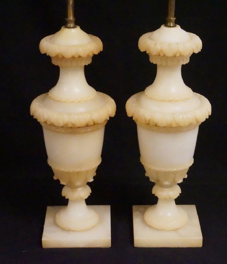 ALABASTER LAMPS: PAIR OF CARVED ALABASTER LAMPS. 28 1/2 INCHES TALL INCLUDING THE FIXTURES.