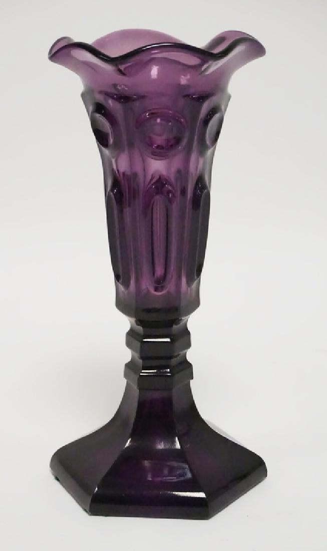 NEW ENGLAND FLINT GLASS VASE: NEW ENGLAND AMETHYST FLINT GLASS VASE WITH A PATTERN OF CIRCLES AND ELIPSES. FLARED RUFFLED RIM. CIRCA 1850-708 5/8 IN HIGH