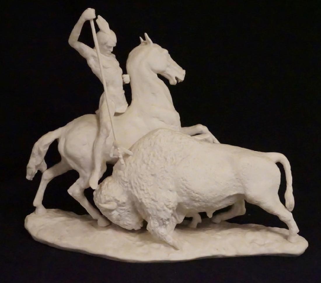 LASLO ISPANKY: LASLO ISPANKO LARGE PORCELAIN FIGURE OF A NATIVE AMERICAN INFIAN ON HORSEBACK SPEARING A BUFFALO. 17 INCHES LONG. 13 3/4 INCHES HIGH. LIMITED EDITION OUT OF 350. PIECE OF SPEAR MISSING ABOVE THE HAND.