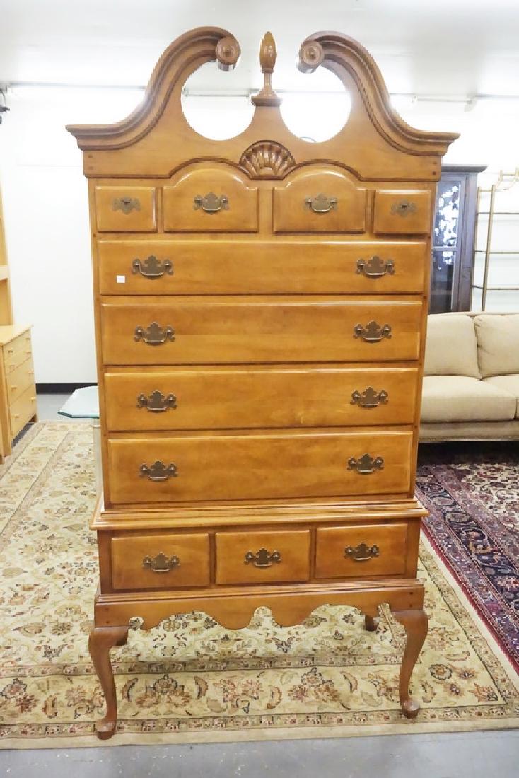 HIGHBOY: HIGHBOY WITH CABRIOLE LEGS, SHELL CARVING, AN A BROKEN ARCH TOP. 76 1./2 INCHES HIGH. 38 1/2 INCHES WIDE.
