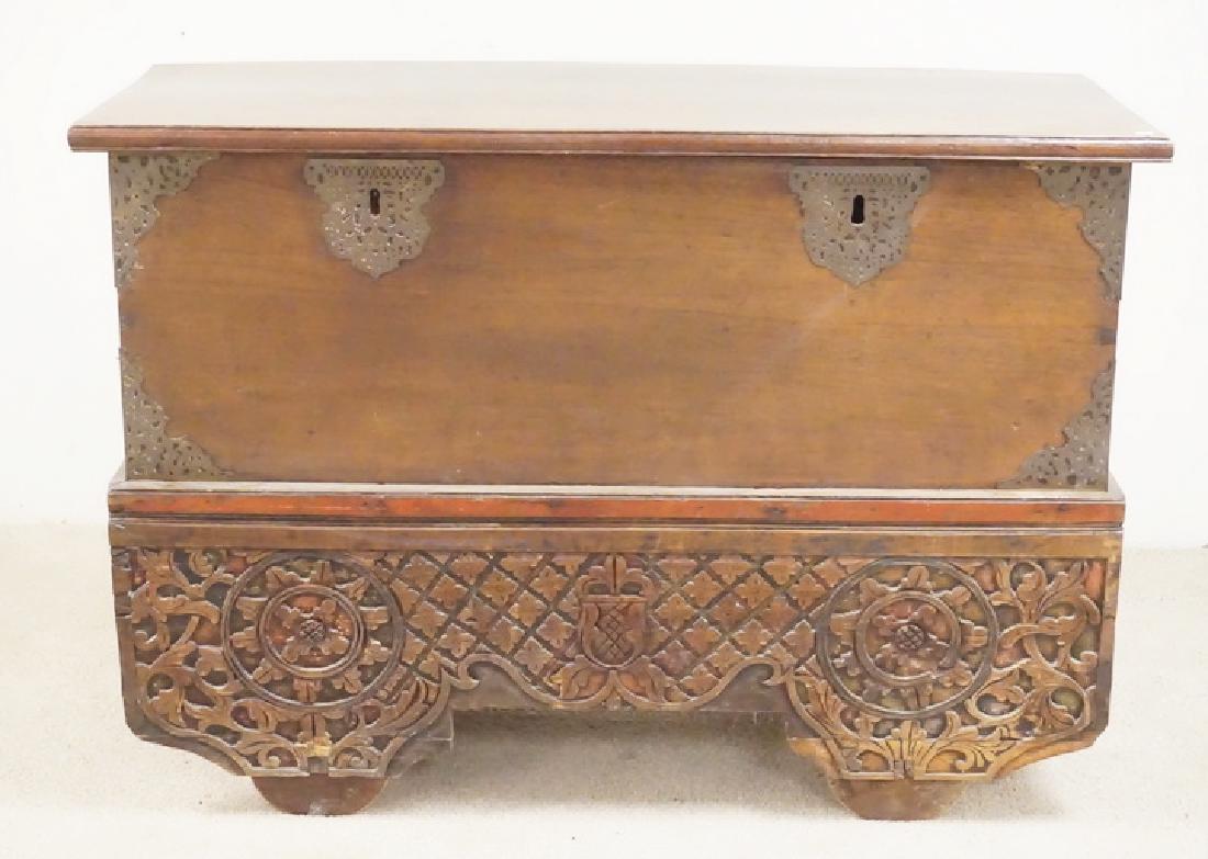 ANTIQUE DOWERY CHEST: ANTIQUE DOWERY CHEST. DOVETAILED CONTRUCTION. ORNATELY CARVED SKIRT AND BRASS MOUNTS. ONE WHEEL HAS LOSSES. 53 X 22 1/2 AND 37 INCHES HIGH.