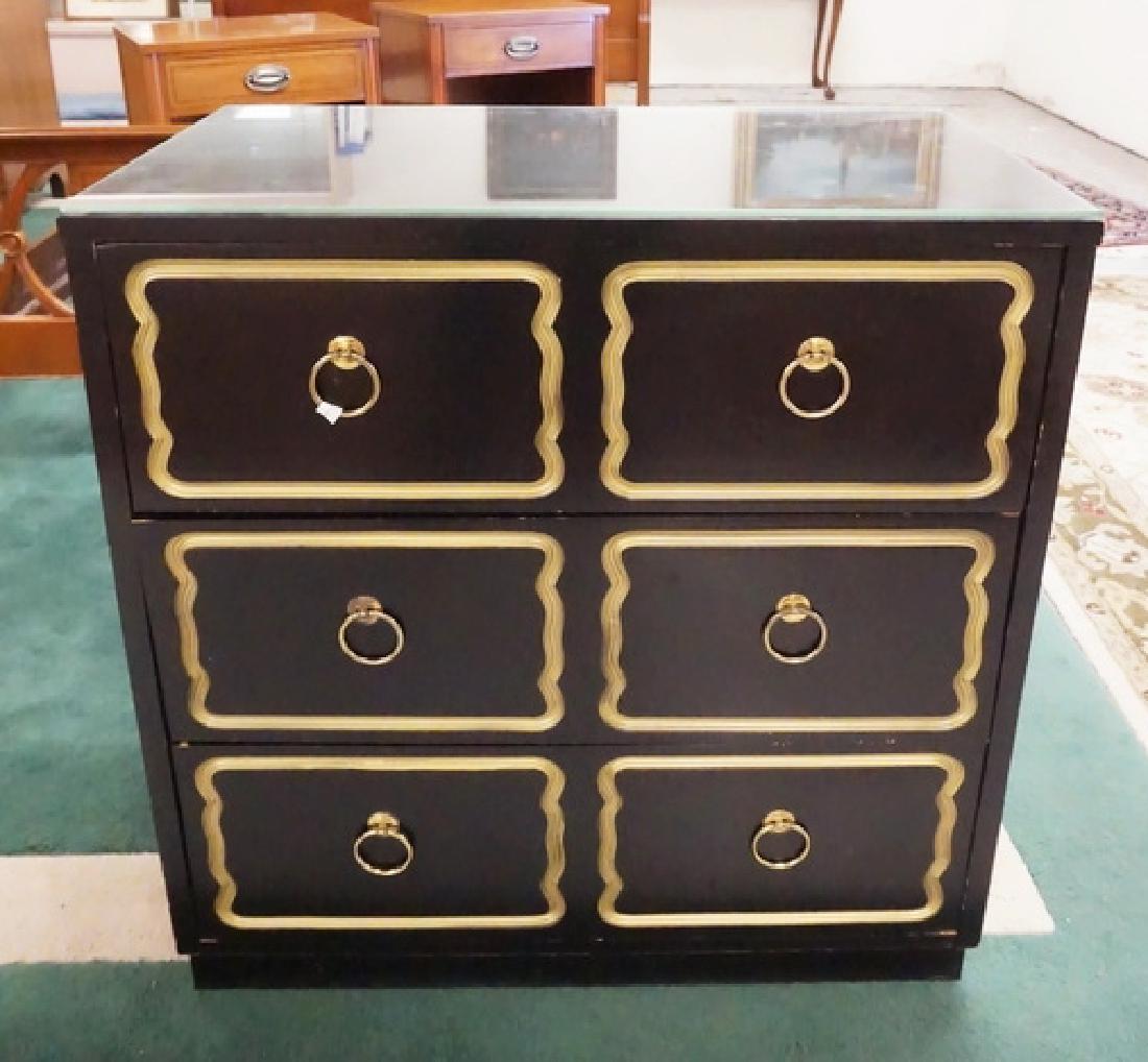 DOROTHY DRAPER CHEST: EBONIZED AND GOLD GILT 3 DRAWER CHEST ATTRIBUTED TO DOROTHY DRAPER. 30 1/4 INCHES WIDE. 31 1/2 INCHES HIGH. COMES WITH A GLASS TOP.