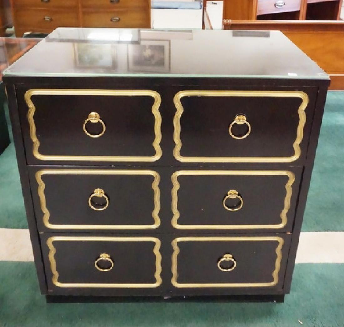 DOROTHY DRAPER CHEST: EBONIZED AND GOLD GILT 3 DRAWER CHEST ATTRIBUTED TO DOROTHY DRAPER. 30 1/4 INCHES WIDE. 31 1/2 INCHES HIGH. COMES WITH A GLASS TOP.