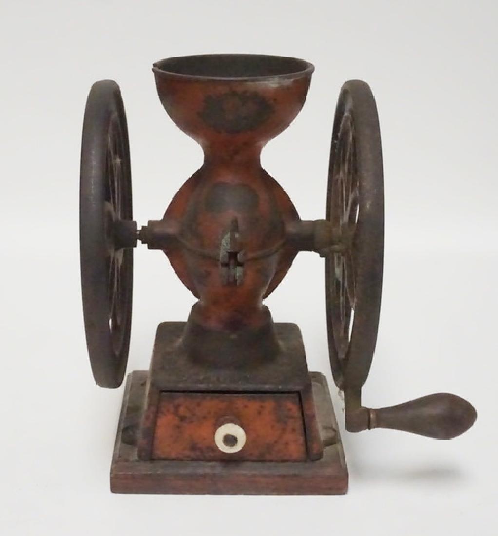 ENTERPRISE COFFEE GRINDER: ANTIQUE ENTERPRISE CAST IRON COFFEE GRINDER. MISSING LID AND GRINDING GEAR. 11 1/2 INCHES HIGH.