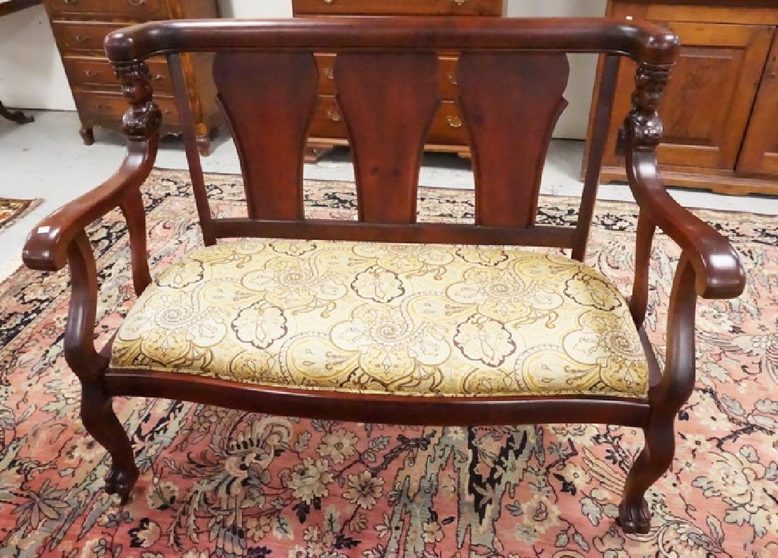 CARVED SETTEE: SETTEE WITH FEMALE BUSTS CARVED INTO THE UPRIGHTS. 51 1/2 INCHES WIDE. 39 1/2 INCHES HIGH.