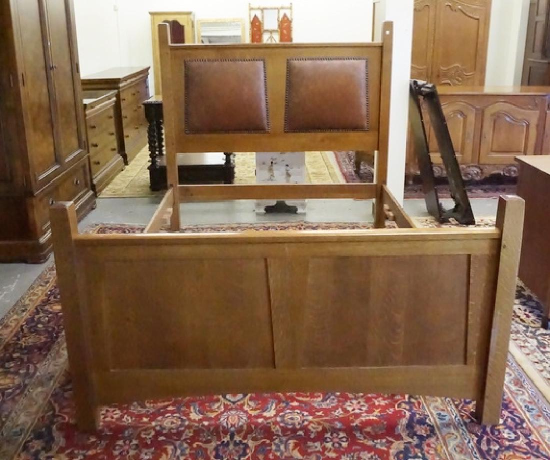 STICKLEY OAK BED: STICKLEY FULL SIZE OAK BED WITH 2 PADDED LEATHER INSERTS IN THE HEADBOARD. 63 IN WIDE, 87 1/2 IN LONG