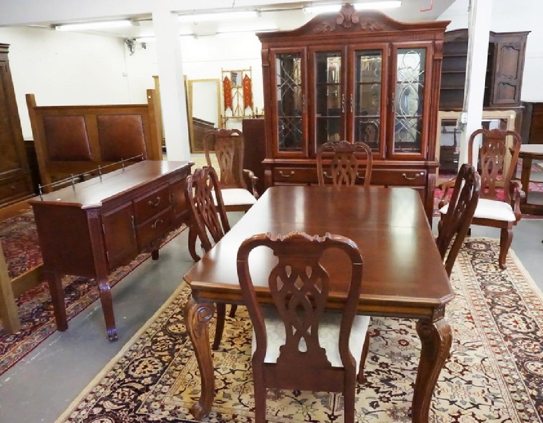 9 PC MAHOGANY DINING ROOM: 9 PC MAHOGANY DINING ROOM SUITE. TABLE W/2 SKIRTED LEAVES, 6 CHAIRS, LIGHTED BREAKFRONT AND SERVER. BREAKFRONT IS 64 IN WIDE