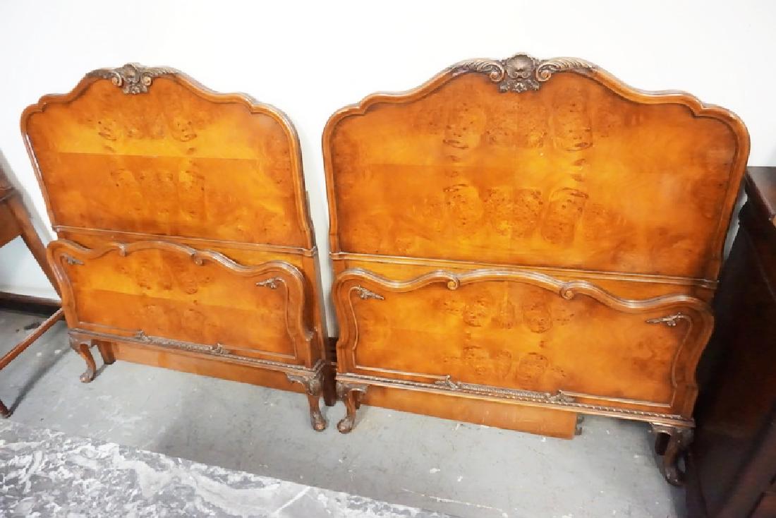 PAIR OF CARVED WALNUT TWIN BEDS: PAIR OF CARVED WALNUT TWIN BEDS.