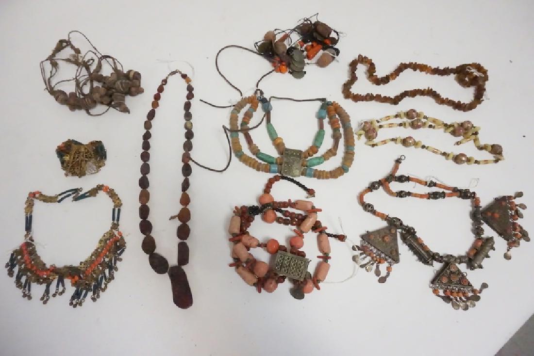 10 PCS MIDDLE EASTERN/ASIAN JEWELRY: 10 PCS MIDDLE EASTERN/ASIAN JEWELRY. INCLUDES AMBER, BEADS, METALWORK, ETC.