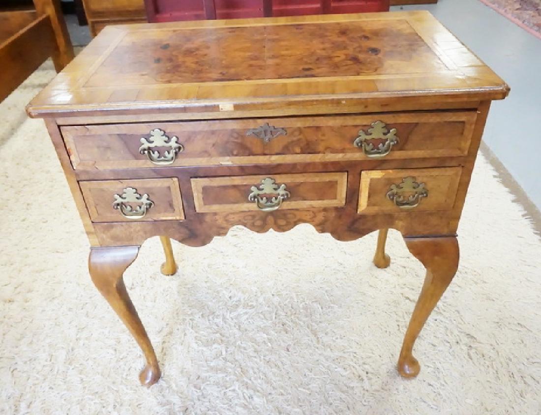 ANTIQUE LOW BOY: ANTIQUE LOW BOY WITH BURLED VENEERS ALONG WITH BANDED DRAWER FRONTS AND TOP. CABRIOLE LEGS. SOME LOSSES TO VENEER. 28 1/2 INCHES WIDE. 29 1/2 INCHES HIGH..