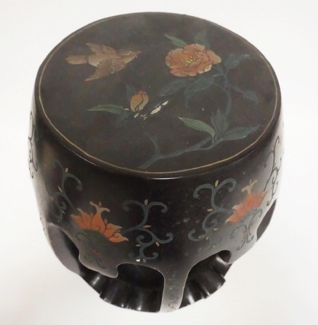 BLACK LACQUERED GARDEN SEAT: BLACK LACQUERED ASIAN GARDEN SEAT WITH FLORAL DECORATION. 16 1/2 INCHES HIGH.