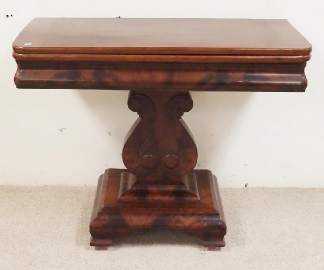 ANTIQUE EMPIRE MAHOGANY: ANTIQUE EMPIRE MAHOGANY FLIP TOP GAME TABLE. SOLID LYRE BASE WITH OGEE BRACKET FEET. 35 3/4 INCHES WIDE. 28 INCHES HIGH.