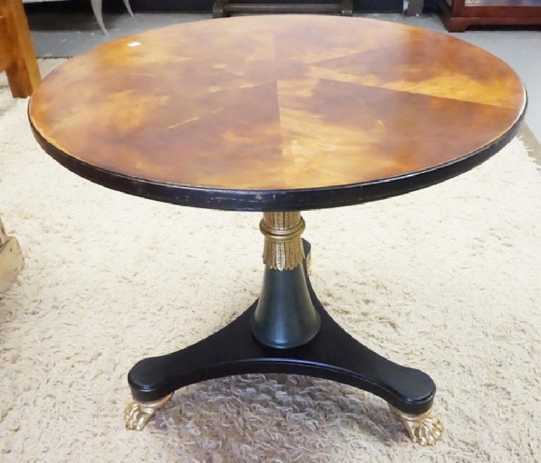 HENREDON LAMP TABLE: HENREDON LAMP TABLE. EBONIZED AND GOLD GILT. 26 1/2 INCHES HIGH. 30 INCH DIA.