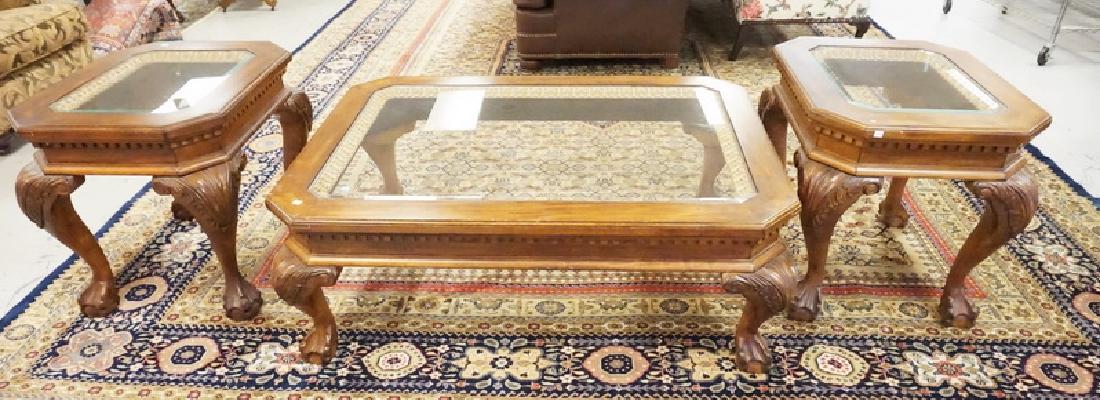 3 PC CARVED LIVING ROOM TABLE SET: 3PCS CARVED COFFE TABLE AND 2 END TABLES WITH INSET GLASS TOPS. COFFEE TABLE MEASURES 38 X 52 X 19 INCHES.