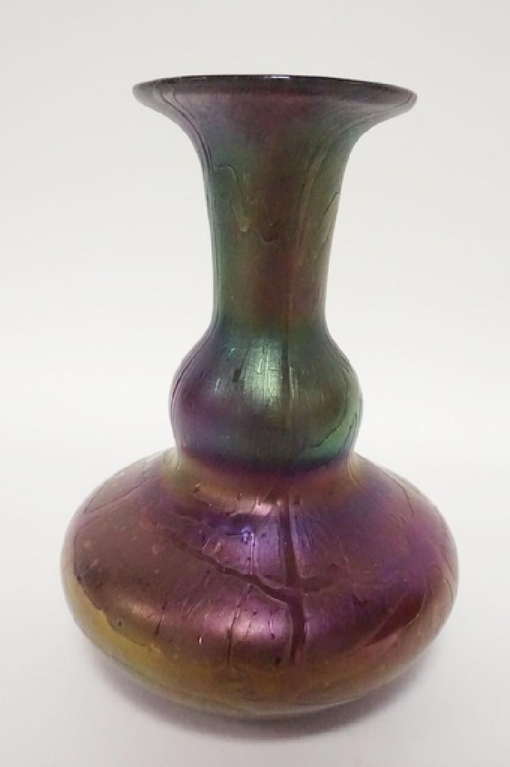 ART GLASS VASE: IRIDESCENT ART GLASS VASE W/ TEXTURED SURFACE AND RANDOM THREADING ON AMETHYST GLASS. POLISHED PONTIL. PROBABLY BOHEMIAN. 6 3/8 IN HIGH