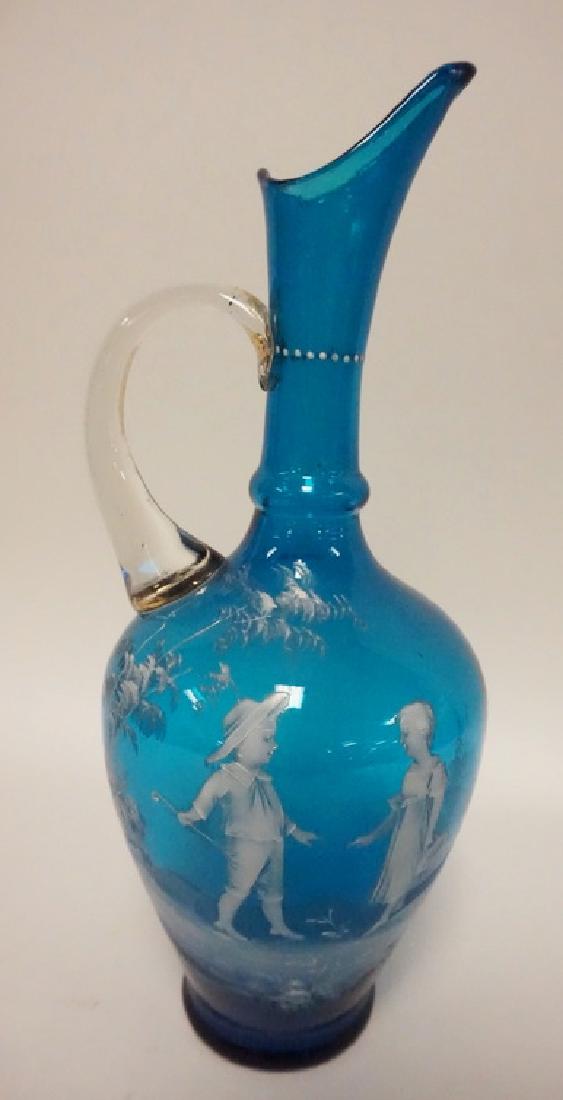 MARY GREGORY: MARY GREGORY GLASS EWER IN BLUE. 12 3/4 INCHES HIGH.