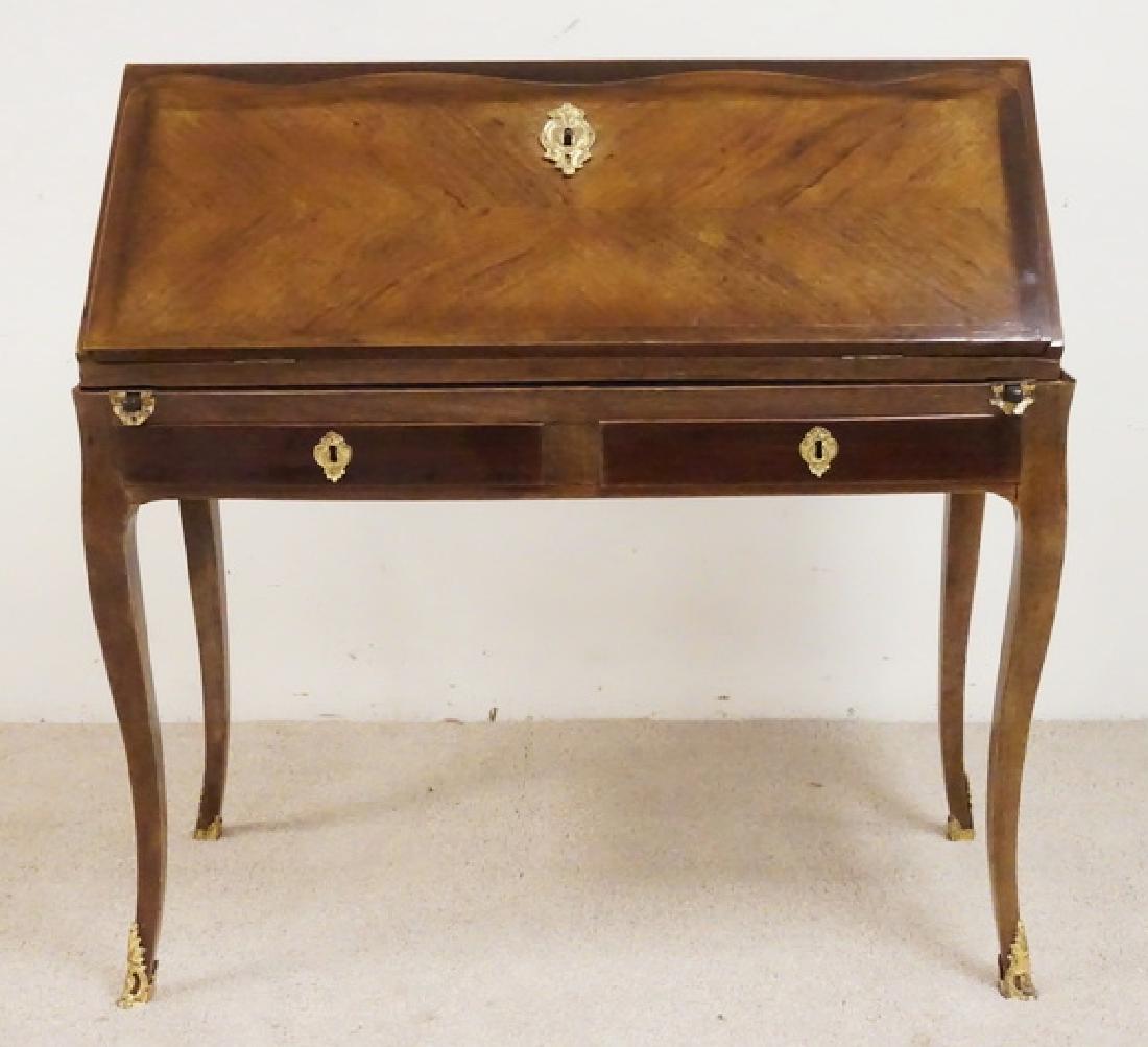 SLANT FRONT DESK: ENGLISH SLANT FRONT DESK WITH GILT ORMOLU AND BOOK MATCHED VENEERS. 38 1/4 INCHES WIDE. 38 INCHES HIGH.