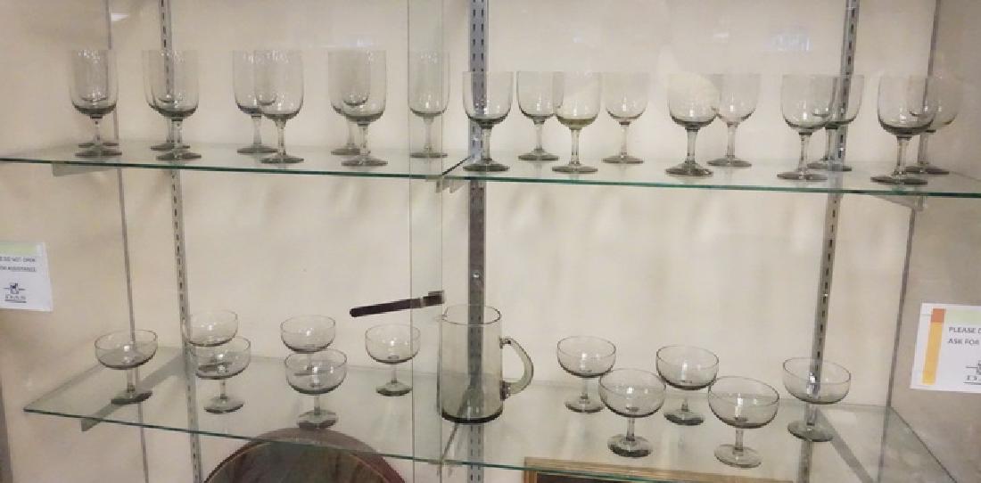 ORREFORS SMOKE GLASS RHAPSODY STEMWARE AND PITCHER: 31 PC ORREFORS RHAPSODY IN SMOKE GLASS. 7 IN PITCHER AND 3 SIZES STEMWARE. TALLEST STEMS 6 3/4 IN
