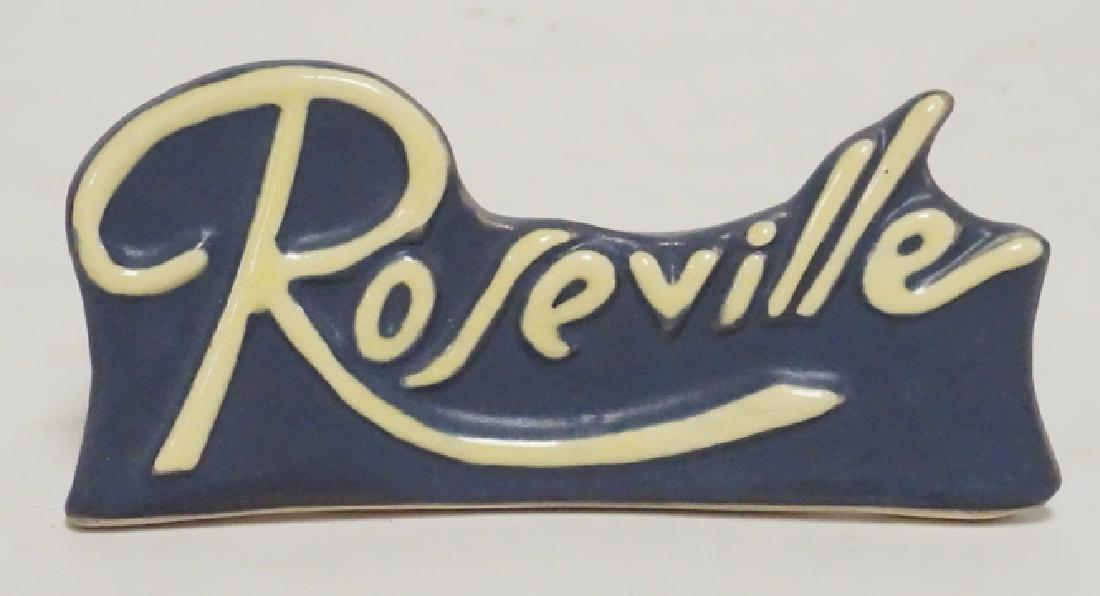 ROSEVILLE: ROSEVILLE ART POTTERY DEALERS PLAQUE. 6 INCHES WIDE.