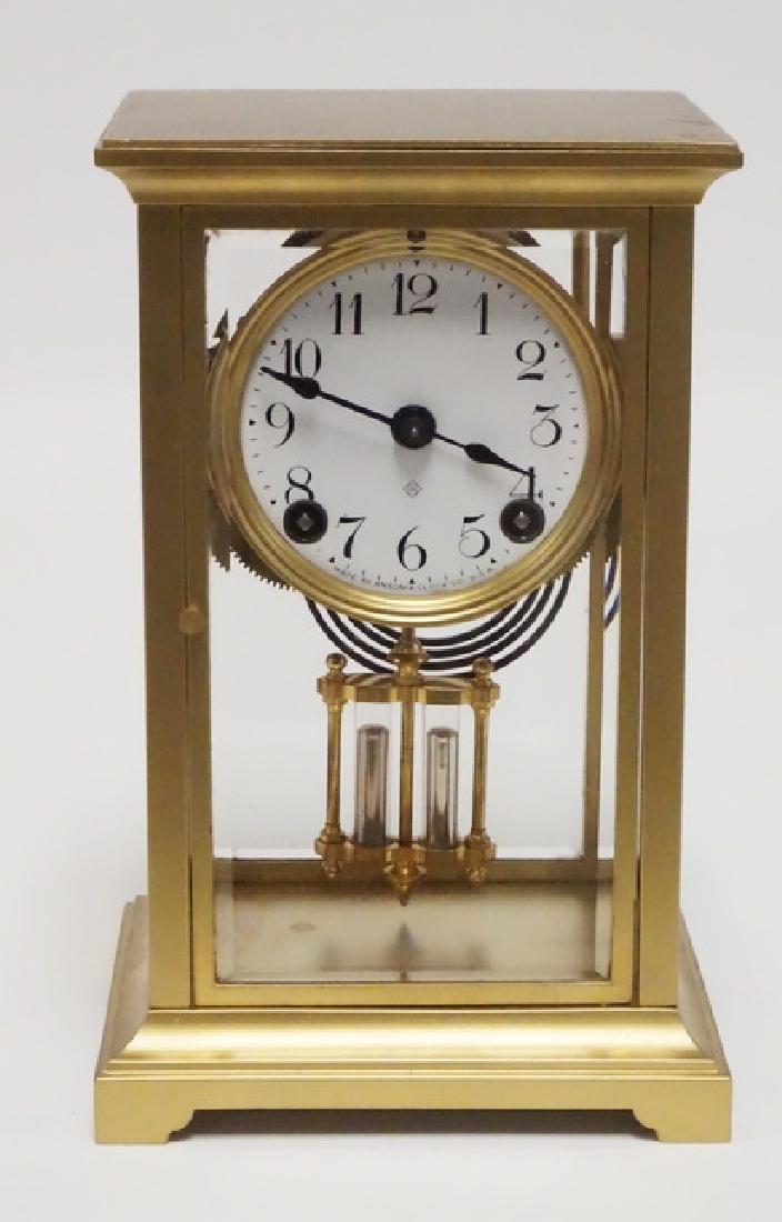 ANSONIA CLOCK: ANSONIA CRYSTAL REGULATOR CLOCK. WITH PENDULUM & KEY. 8 7/8 INCHES HIGH. 5 5/8 INCHES WIDE.