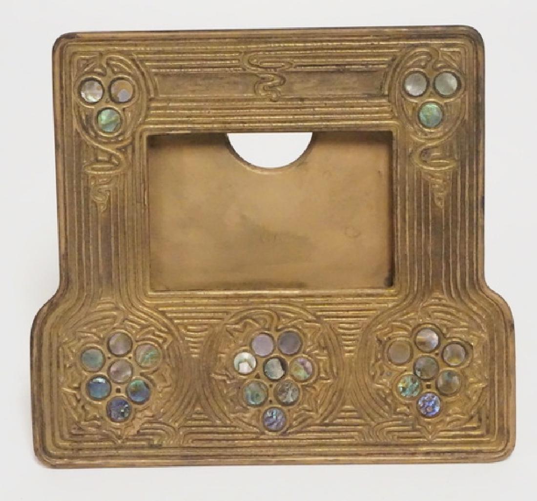 TIFFANY STUDIOS CALENDAR: TIFFANY STUDIOS BRONZE AND ABALONE INLAY CALENDAR FRAME #1166. 6 5/8 X 6 INCHES.