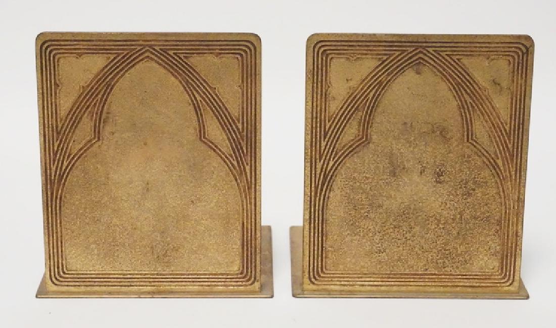 TIFFANY STUDIOS *GRADUATE* BOOKENDS: TIFFANY STUDIOS GRADUATE PATTERN GILT BRONZE BOOKENDS. 5 INCHES WIDE. 5 5/8 INCHES HIGH.